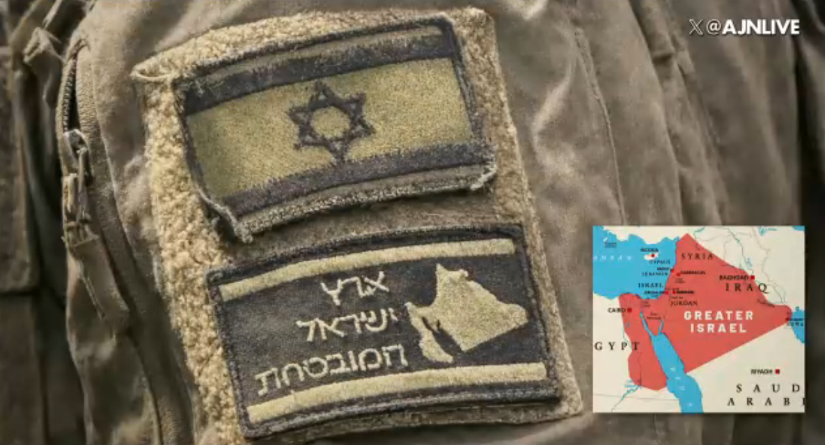Naomi Wolf Crashes Out on 'The Alex Jones Show' Over October 7 stand-down Claims 3 Close-up of a tactical uniform sleeve displaying military morale patches alongside an inset map diagram highlighting the concept of Greater Israel.