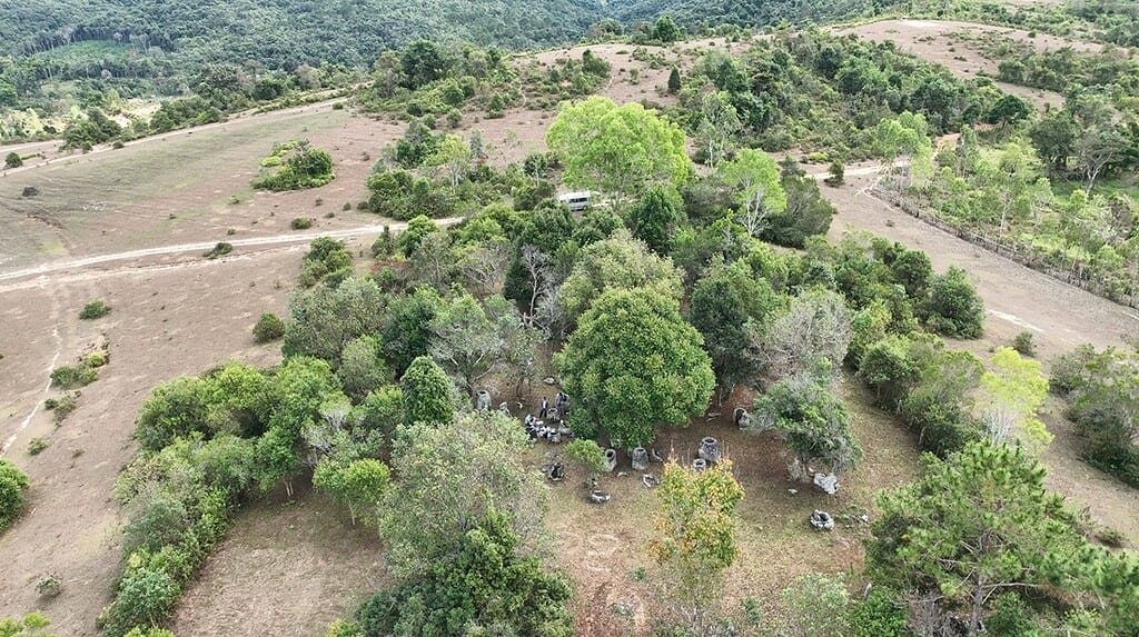 Ancient Burial Jars in Laos Have Been Running a 2,000-Year Natural Experiment 4 High overhead view of the lightly forested landscape where the ancient stone burial jars are found in Laos