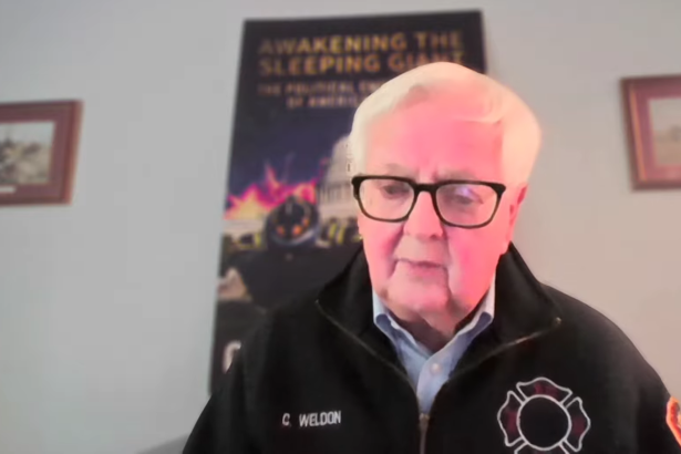 Former Congressman Kurt Weldon speaking during a video interview wearing a black embroidered firefighter jacket.