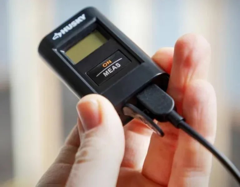 Husky Laser Distance Measuring Tool at Home Depot Size in Hand
